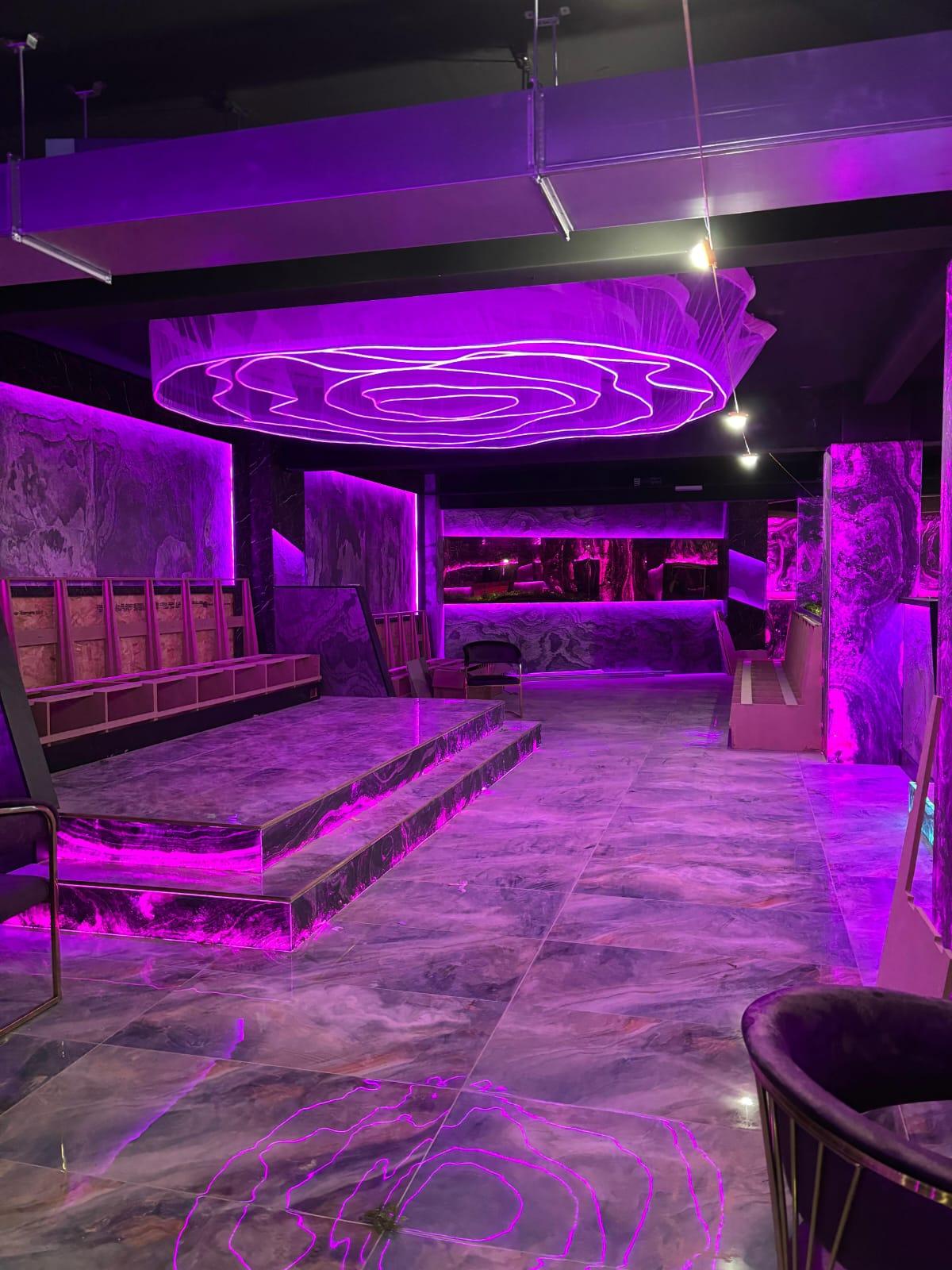 Photograph — raised seating platform beneath the feature ceiling, Café interior fit-out, Birmingham