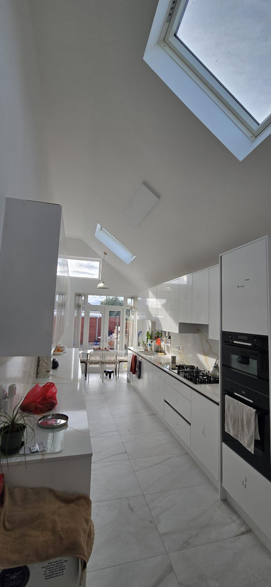 Photograph — kitchen in the extension with sloped ceiling and skylights, Rosedene Avenue, Leicester