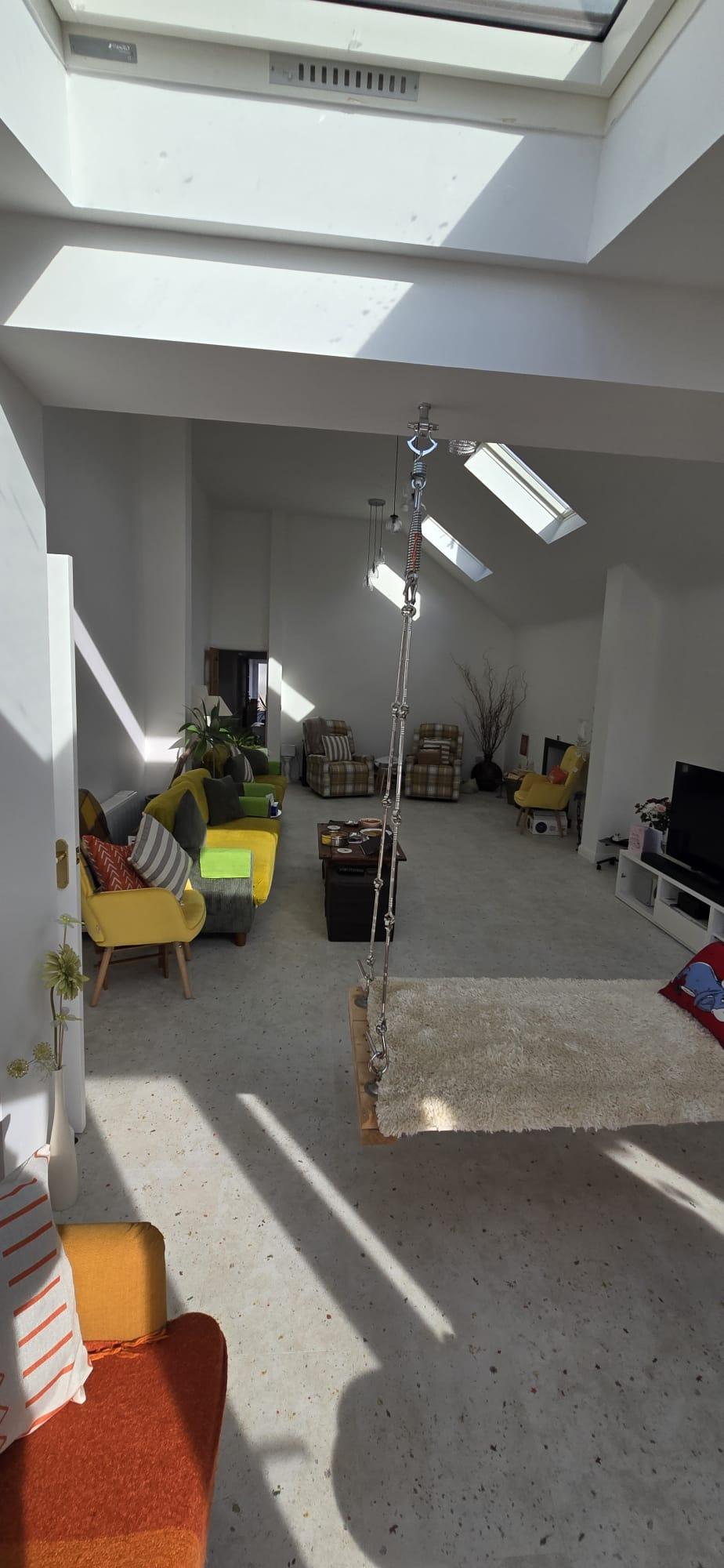 Photograph — open-plan living space in the rear extension under roof skylights, Rosedene Avenue, Leicester